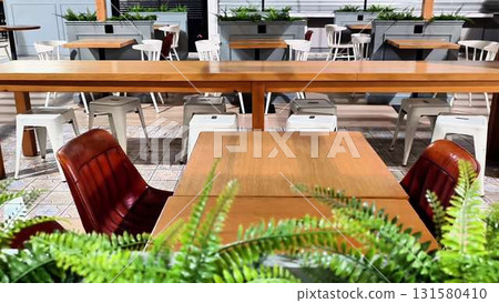 Stylish Outdoor Dining Space Featuring Modern Furnishings for an Inviting Atmosphere Stylish Outdoor Dining Space Featuring Modern Furnishings for an Inviting Atmosphere 131580410