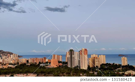 A Stunning Urban Skyline That Beautifully Overlooks the Ocean at Dusk, Creating a Magical Atmosphere A Stunning Urban Skyline That Beautifully Overlooks the Ocean at Dusk, Creating a Magical Atmosphere 131580423