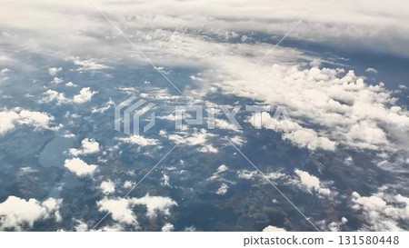 An Aerial Perspective Showcasing a Stunning and Cloudy Landscape Seen from Above An Aerial Perspective Showcasing a Stunning and Cloudy Landscape Seen from Above 131580448