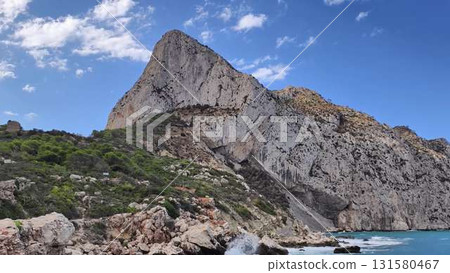 The stunning coastal rock formation contrasts beautifully with the clear blue sky above The stunning coastal rock formation contrasts beautifully with the clear blue sky above 131580467