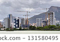 Modern Urban Development Featuring Tower Cranes Amidst a Dynamic Cityscape Environment 131580495