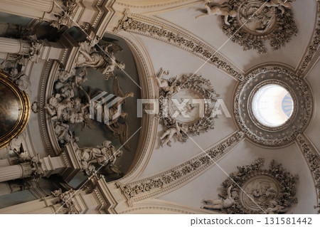 Archbasilica of Saint John Lateran Rome exterior facade and grand baroque interior with golden coffered ceiling vast nave marble statues side chapels ornate altar apse and dome Catholic basilica 131581442