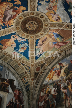 Ornate renaissance ceiling fresco with gilded coffers angels medallions and decorative borders museum interior Rome Italy cultural heritage rich colors no people vertical composition. High quality Ornate renaissance ceiling fresco with gilded coffers angels medallions and decorative borders museum interior Rome Italy cultural heritage rich colors no people vertical composition. High quality 131581443