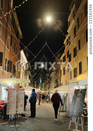 Rome evening street cafe and piazza with outdoor seating food stand and crowd nightlife. High quality photo Rome evening street cafe and piazza with outdoor seating food stand and crowd nightlife. High quality photo 131581456