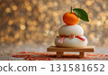 Kagami mochi and oranges against a golden background: Japanese New Year decorations 131581652