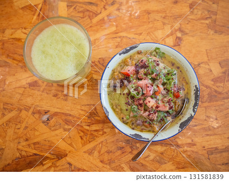 [Jordan] Something resembling a stew is served on a plate on a table at a friend's house in the capital, Amman. 131581839