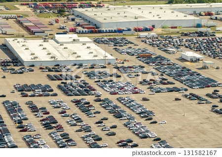Cars parked ready for sale on automotive factory parking lot Cars parked ready for sale on automotive factory parking lot 131582167