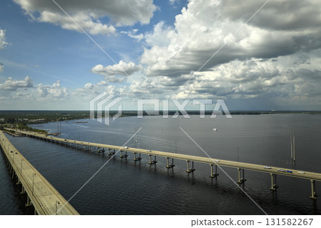Barron Collier Bridge and Gilchrist Bridge in Florida with moving traffic. Transportation infrastructure in Charlotte County connecting Punta Gorda and Port Charlotte over Peace River 131582267