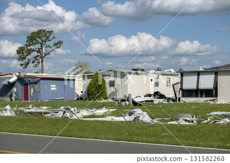 Badly damaged mobile homes after hurricane in Florida residential area. Consequences of natural disaster 131582268