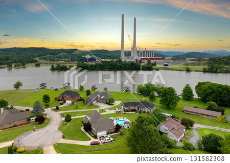 Air pollution from electric energy production from fossil fuel. Residential community homes near Kingston power station in Tennessee. Toxic emissions from coal-fired power plant producing electricity 131582308