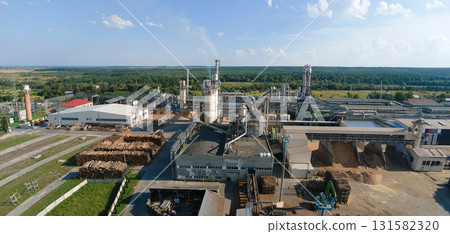Aerial view of wood processing factory with stacks of lumber at plant manufacturing yard. 131582320