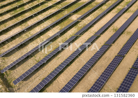 Aerial view of solar power plant. Electric panels for producing clean ecologic energy. 131582360