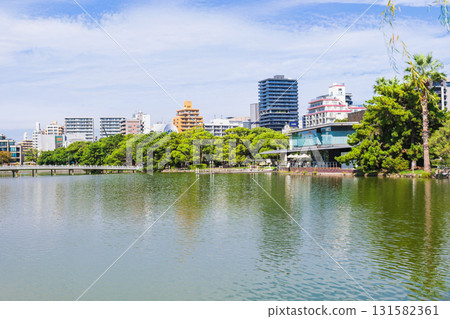 Fukuoka Ohori Park Kangetsu Bridge and boat dock 131582361