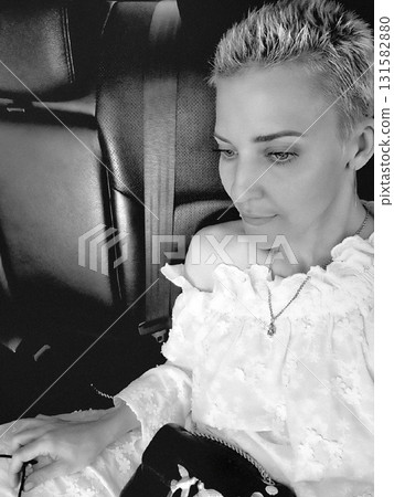 Woman in White Ruffle Top in Car Woman in White Ruffle Top in Car 131582880
