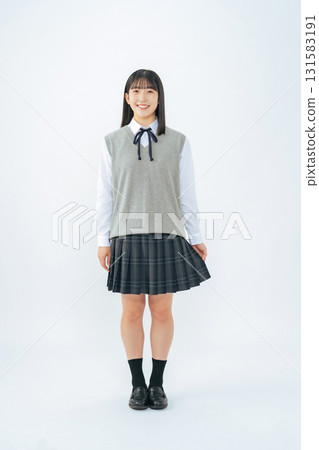 Full-body photo of a female student in uniform 131583191