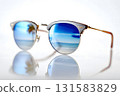 Top-Down View of Stylish Sunglasses on Clean Surface for Branding and Editorial Use 131583829