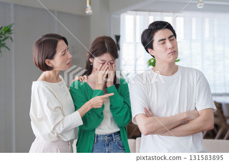 A woman gets angry at a man who made her friend cry 131583895