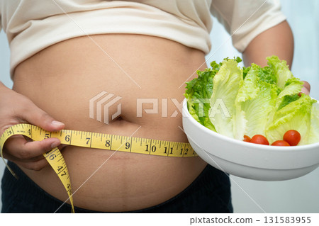 Asian woman with fat belly big size overweight and obesity with healthy food. Asian woman with fat belly big size overweight and obesity with healthy food. 131583955