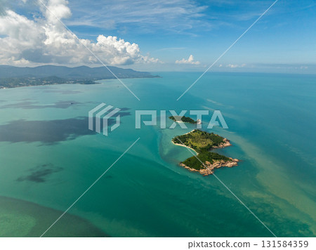 Scenic view of isolated tropical islands surrounded by turquoise waters and lush greenery. Bo Put. Koh Samui, Thailand. Scenic view of isolated tropical islands surrounded by turquoise waters and lush greenery. Bo Put. Koh Samui, Thailand. 131584359