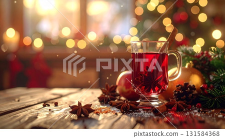 Close-up of a wooden cafe table with mulled wine, cinnamon sticks and star anise 131584368