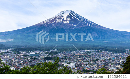 Scenic view of Mount Fuji with Fujiyoshida City in springtime Scenic view of Mount Fuji with Fujiyoshida City in springtime 131584611