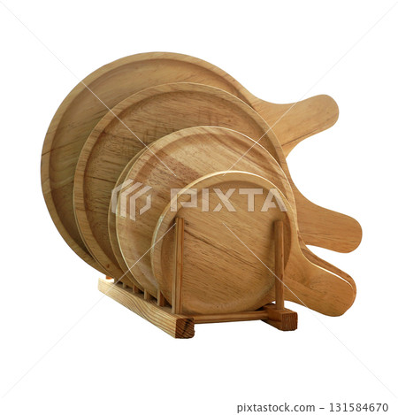 Round wooden cutting boards with handles in various sizes fit in a wooden holder isolated on white background Round wooden cutting boards with handles in various sizes fit in a wooden holder isolated on white background 131584670