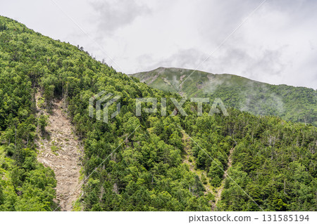 Mt. Hijiri (Oku-Hijiri) seen from the Hijirizawa route hiking trail. Hijiri-dake hiking in the Southern Alps. 131585194