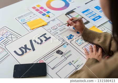 UX UI Design Process. Creative brainstorming session with wireframes and color palettes. 131586413