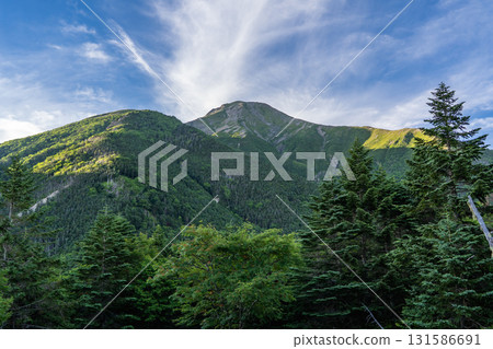 View of Mt. Hijiri (Mae Hijiri) and Mt. Ko Hijiri from Hijiridai. Hijiri climbing in the Southern Alps. View of Mt. Hijiri (Mae Hijiri) and Mt. Ko Hijiri from Hijiridai. Hijiri climbing in the Southern Alps. 131586691