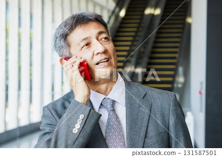 Businessmen talking on smartphone 131587501