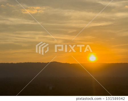 mountain view with sun ray and cloudy sky 131589342