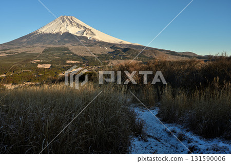 Mount Fuji in the morning as seen from the snowy trail leading up to Mount Echizen in the Ashitaka Mountains Mount Fuji in the morning as seen from the snowy trail leading up to Mount Echizen in the Ashitaka Mountains 131590006