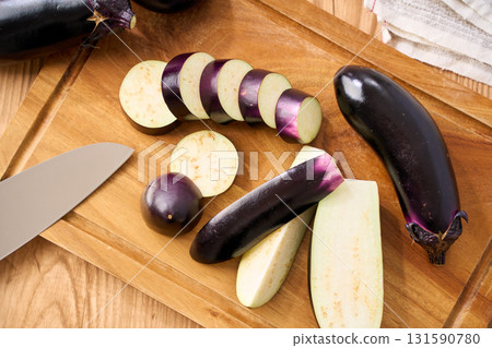 Eggplant cut on a cutting board | Image of preparation and cooking process 131590780