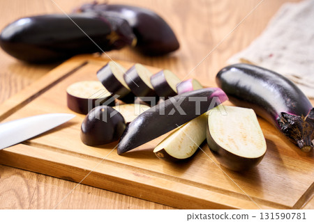Eggplant cut on a cutting board | Image of preparation and cooking process 131590781