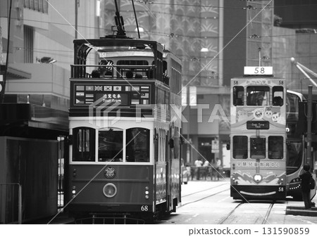 Monochrome Hong Kong - Trams (streetcars) - the means of transportation for the common people in Hong Kong. Trams have been running since the British colonial period. This is a tourist train. Monochrome Hong Kong - Trams (streetcars) - the means of transportation for the common people in Hong Kong. Trams have been running since the British colonial period. This is a tourist train. 131590859