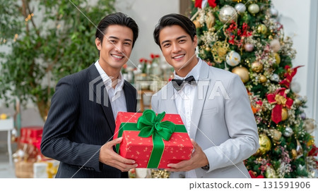 asian man giving a present to his boyfriend 131591906