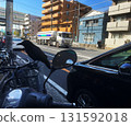 bird sits on bike in city in Japan 131592018