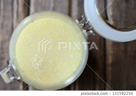 Homemade lemon shio koji (salt koji) with just mixed ingredients and starting to foam. 131592250