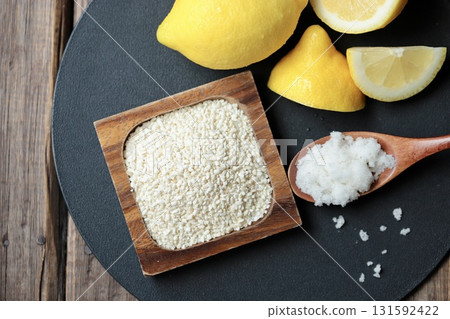 Ingredients for lemon koji before mixing: rice koji, coarse salt, and unwaxed lemon 131592422