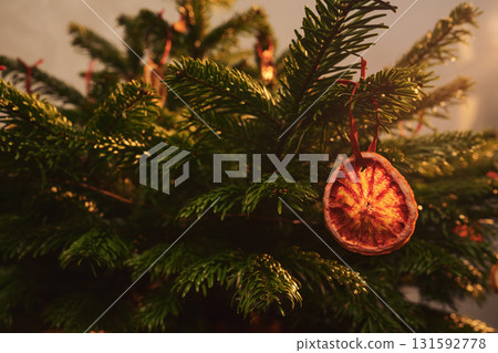 Closeup small christmas tree with natural decorations indoor Closeup small christmas tree with natural decorations indoor 131592778