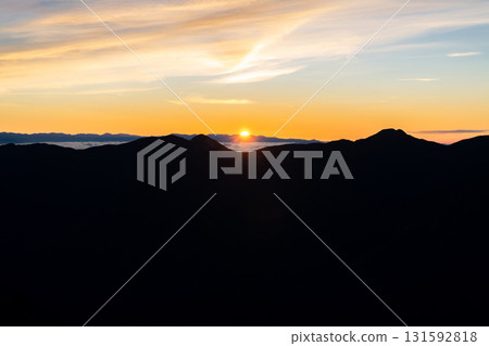 The magic hour sky (sunrise) seen from the summit of Minami-dake in the Southern Alps. Climbing Mt. Hijiri in the Southern Alps The magic hour sky (sunrise) seen from the summit of Minami-dake in the Southern Alps. Climbing Mt. Hijiri in the Southern Alps 131592818