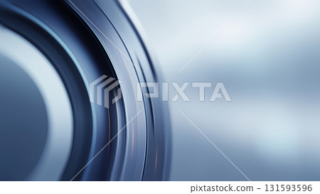 Curved, metallic surface reflecting modern design elements under soft lighting. 131593596