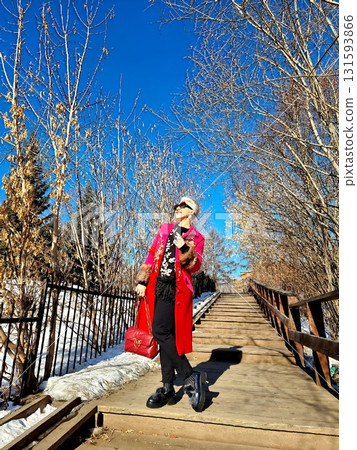 Stylish Woman Walking Up Long Wooden Staircase Stylish Woman Walking Up Long Wooden Staircase 131593866