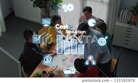 Team Collaboration on Cost Reduction Strategies in Modern Office Environment with Graphical Data Visualization Elements. Raster 131593978