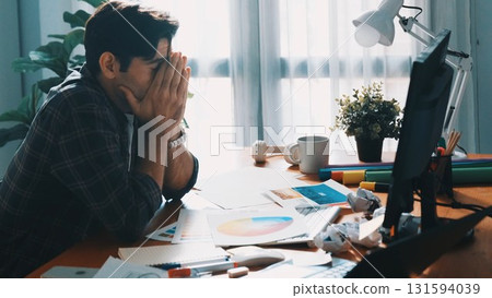 Top down view of designer working on palettes and crumpled paper. Symposium. 131594039