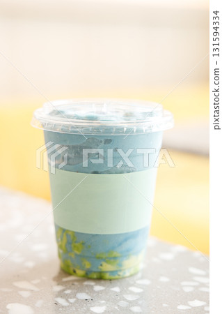 Fresh colorful healthy vegetable and fruit smoothies by the window. 131594334