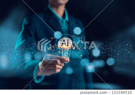 Businesswoman embraces the AI creative innovation concept, with a light bulb symbolizing artificial intelligence powering the modern digital generation of text, image, video, and audio content. 131594510