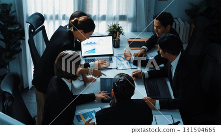 Top view of skilled analytic analysis investment data at meeting. Directorate. 131594665