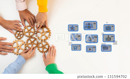 Collaborative Teamwork with Diverse Hands Working on Gears and Visual Symbols Representing Engagement and Communication in Modern Digital Contexts. Raster 131594702