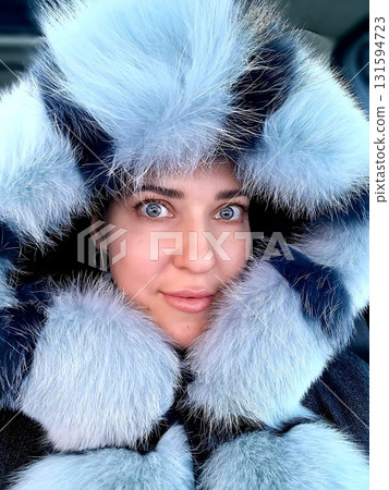 Close-up Portrait of Smiling Woman in Blue Fur Close-up Portrait of Smiling Woman in Blue Fur 131594723